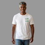 Man wearing a white t-shirt with 'GOD IS GOD' text in a living room.