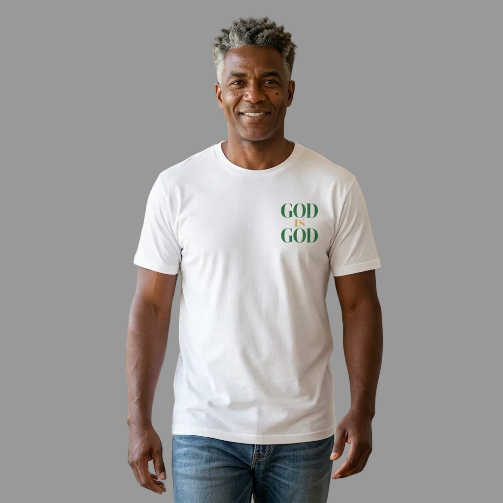 Man wearing a white t-shirt with 'GOD IS GOD' text in a living room.