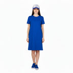 Person wearing a blue and white cap with a logo on a white background