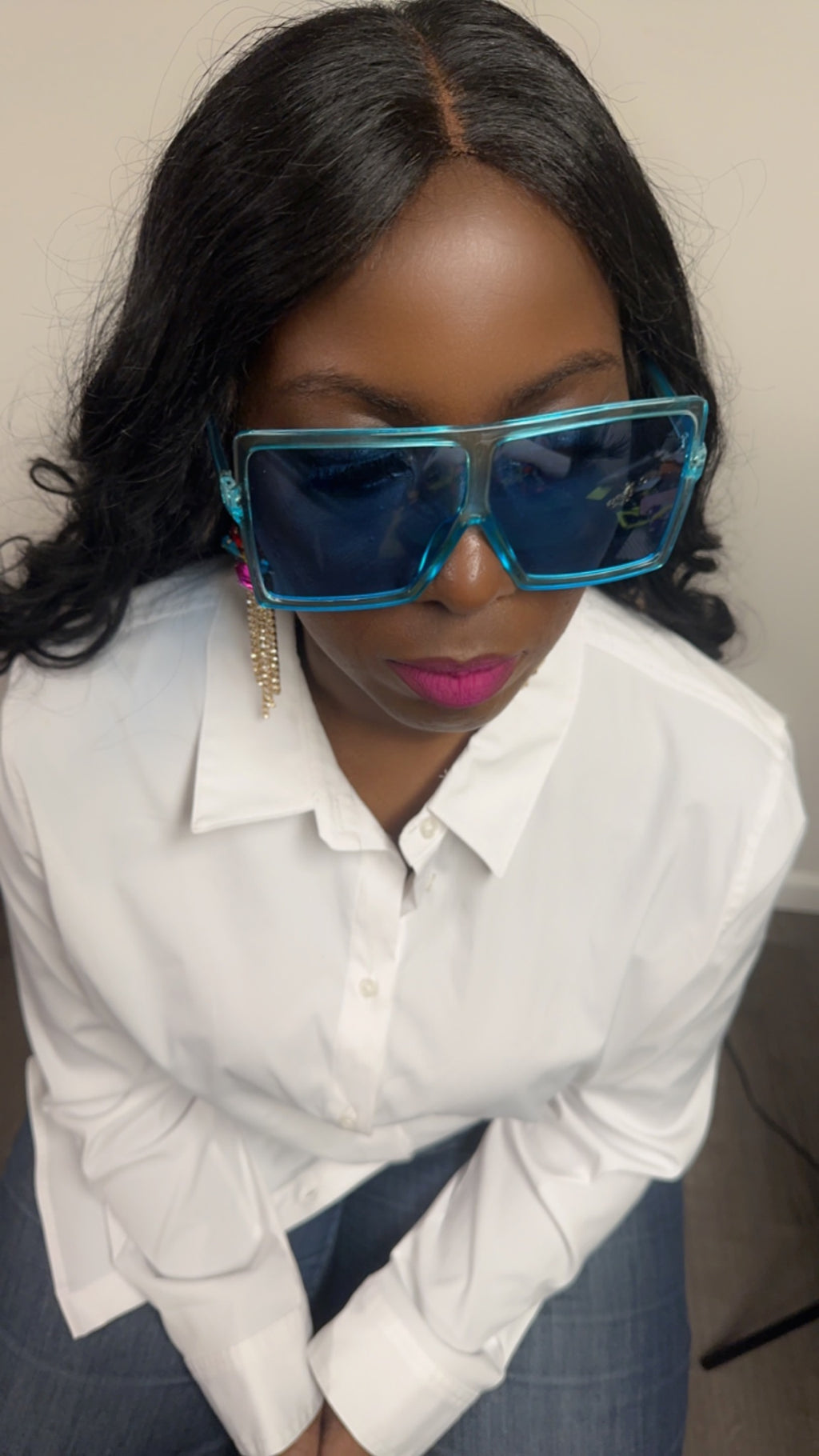 Beautiful woman in oversized blue shades