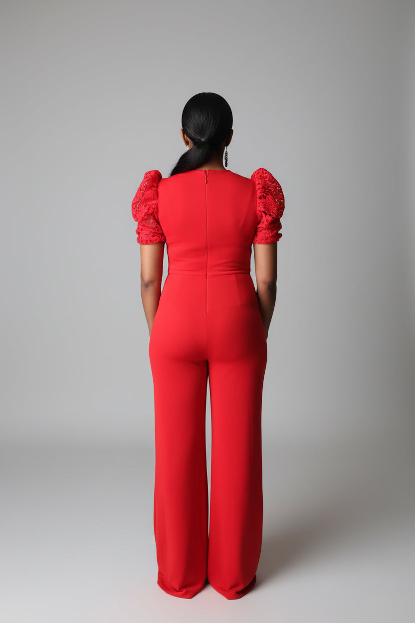 Person wearing a red outfit standing in a living room.