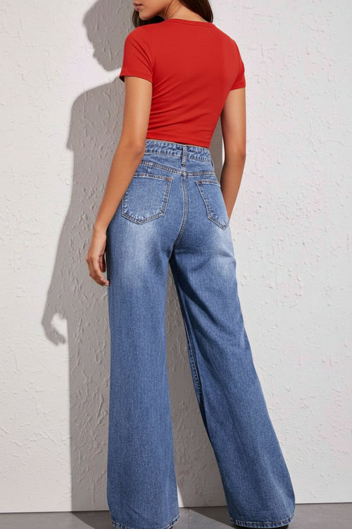 A pair of high waist wide leg jeans with a bell bottom style, featuring a washed-out denim color and pockets in the back.

